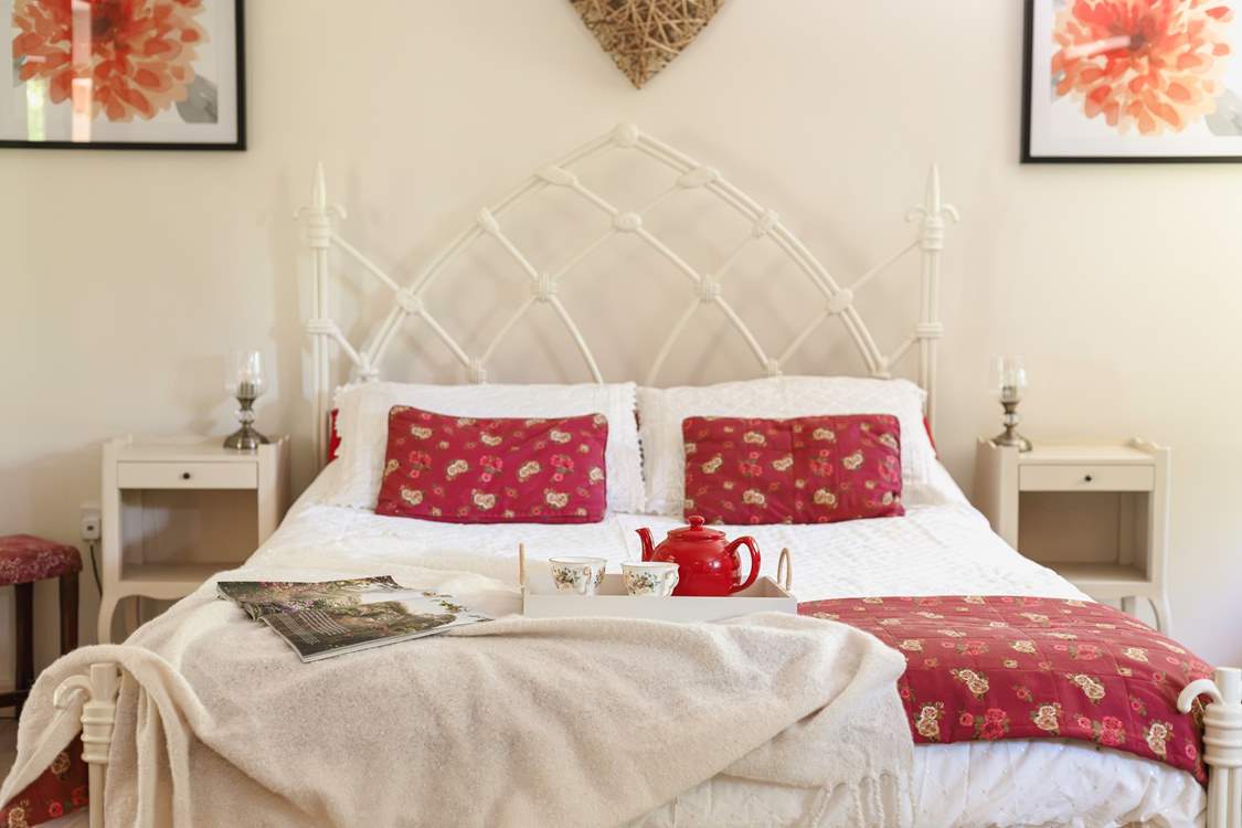 Sumptuous soft furnishings and pretty artwork, create a serene and calm space.