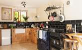 A monochrome marvel - this fully equipped kitchen has both a lovely feature Aga and a conventional oven. - Thumbnail Image