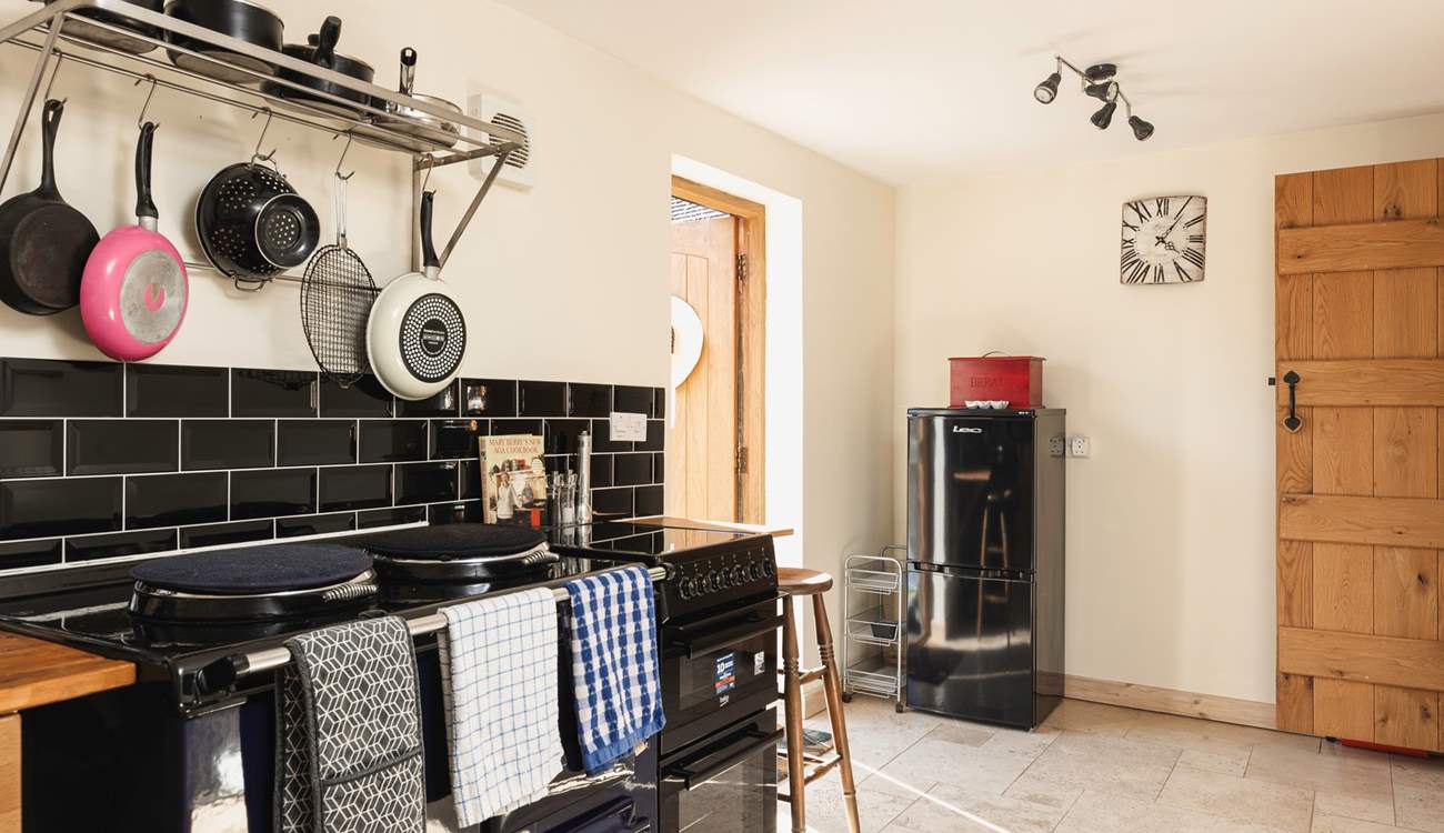 The front door leads you into the cosy kitchen.