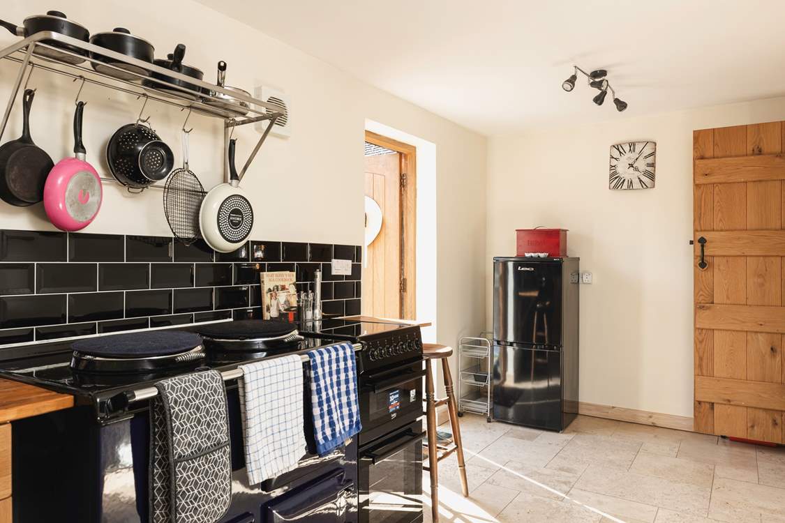 The front door leads you into the cosy kitchen.
