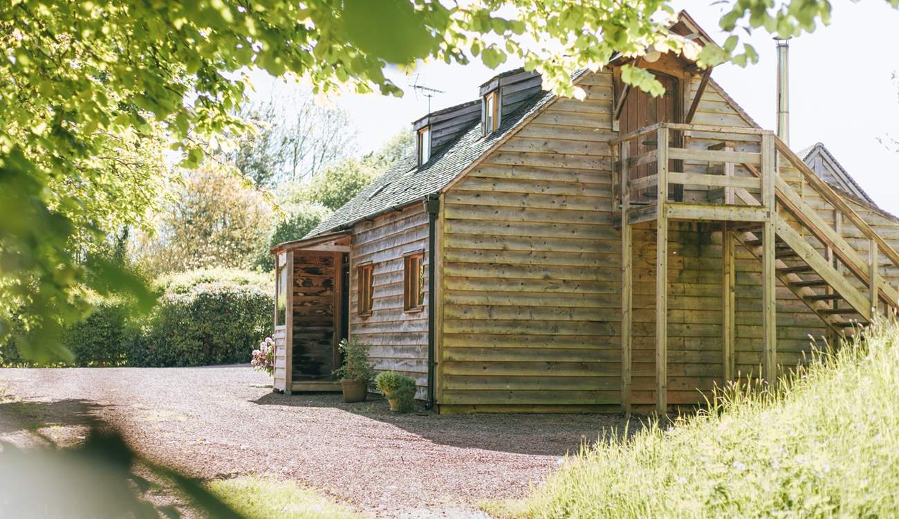 Accessible via an outdoor staircase, the second double bedroom provides privacy and seclusion.