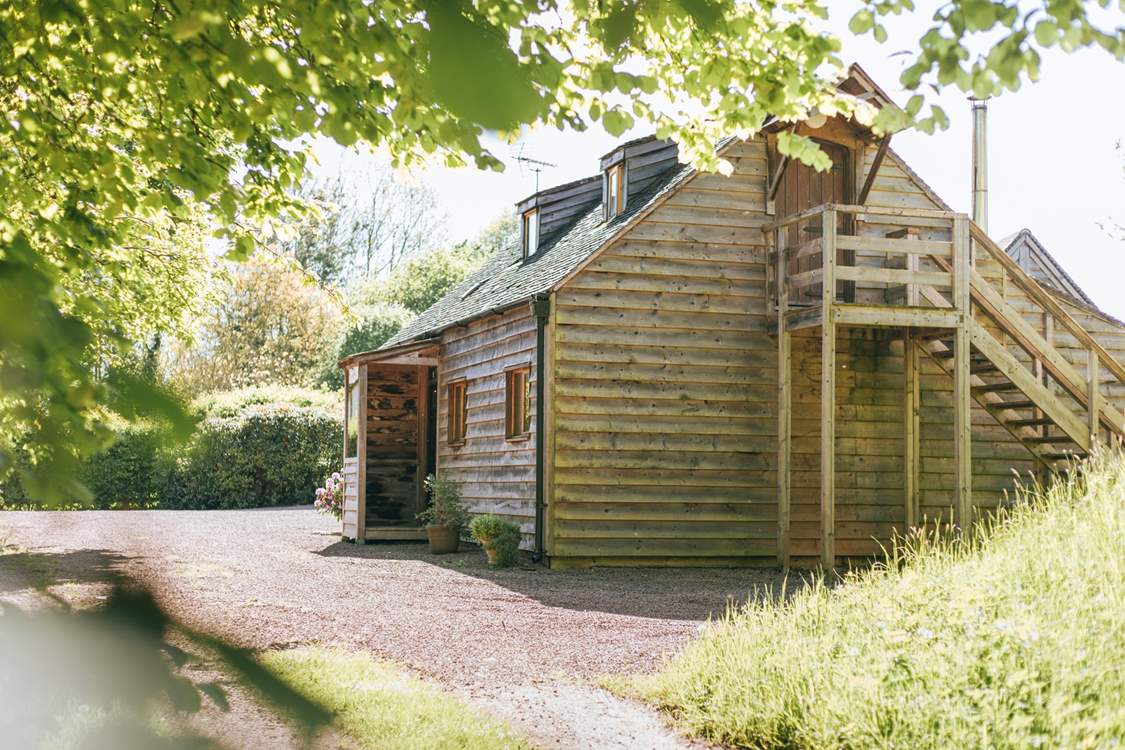 Accessible via an outdoor staircase, the second double bedroom provides privacy and seclusion.