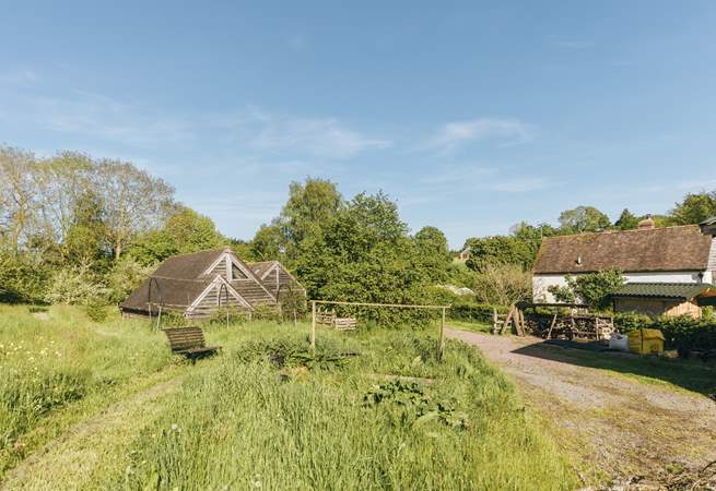 The barn is situated within the serene surroundings of Botloes Farm.