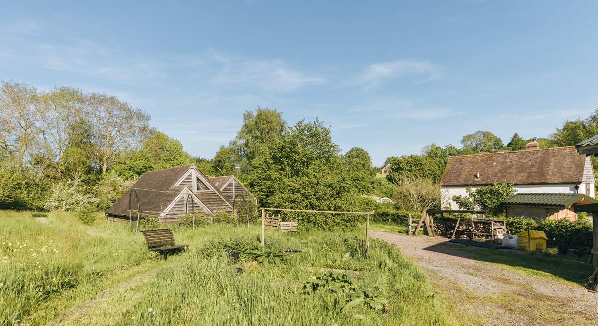 The barn is situated within the serene surroundings of Botloes Farm.