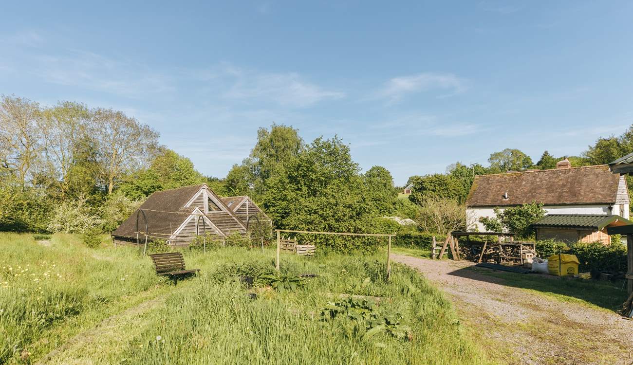 The barn is situated within the serene surroundings of Botloes Farm.