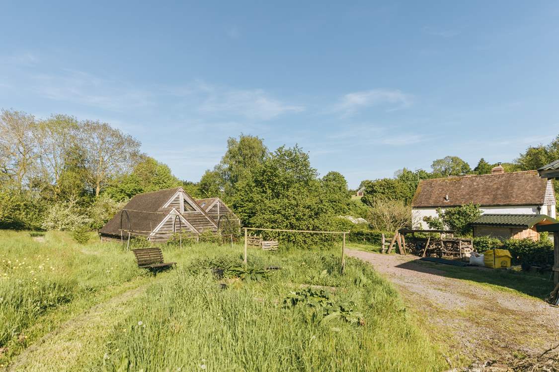 The barn is situated within the serene surroundings of Botloes Farm.