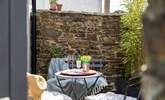 Step out of the patio doors into the courtyard where you can stoke the barbecue and pour a glass of wine. - Thumbnail Image