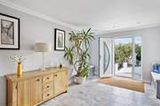 Step out of the front door to find the hot tub and handy seating area.