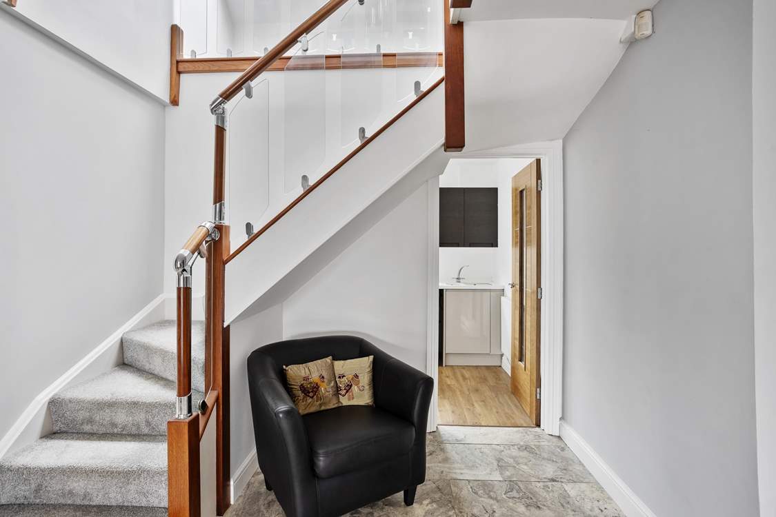 From the main hall you can access all downstairs rooms including the handy utility-room with a washing machine.