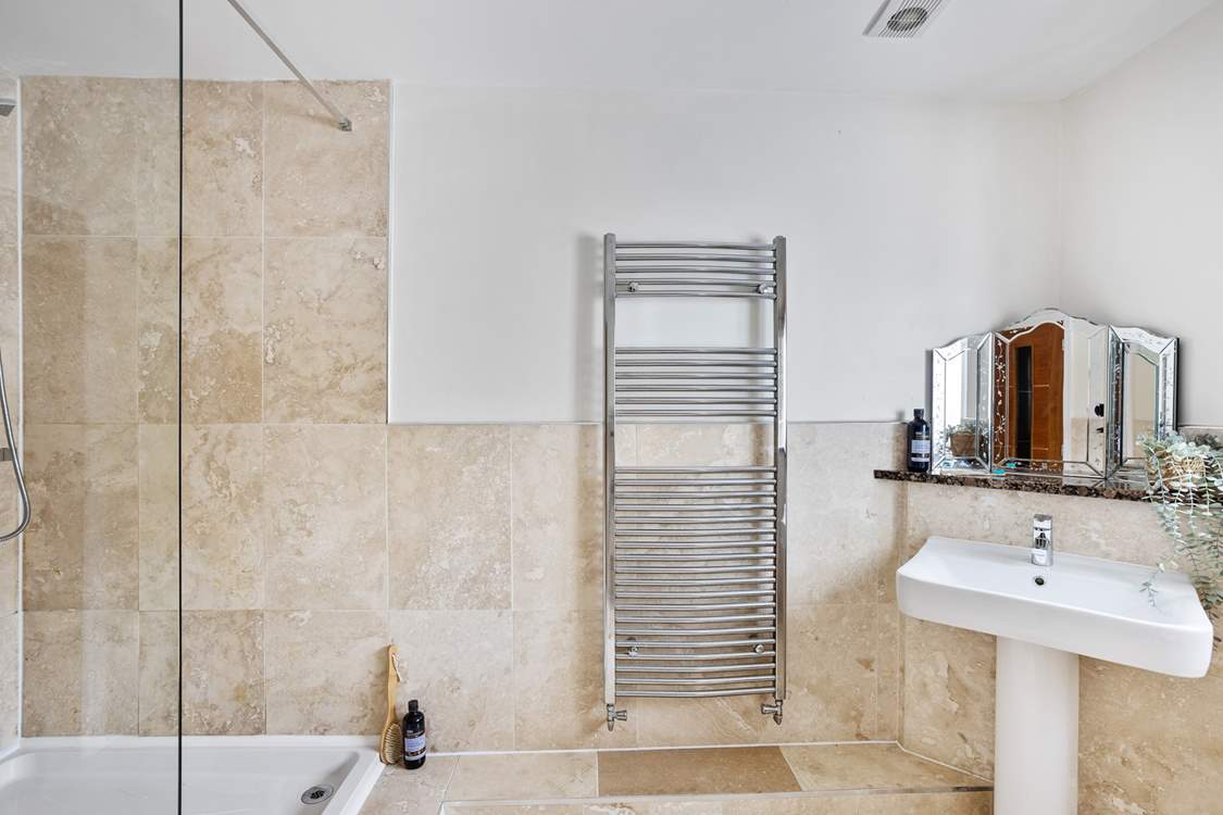 On the ground floor just across the hallway from bedroom 1 you will find this fabulously large shower-room.
