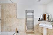 On the ground floor just across the hallway from bedroom 1 you will find this fabulously large shower-room.
