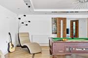 The pool table is a real feature with the games-room directly opposite across the hall.