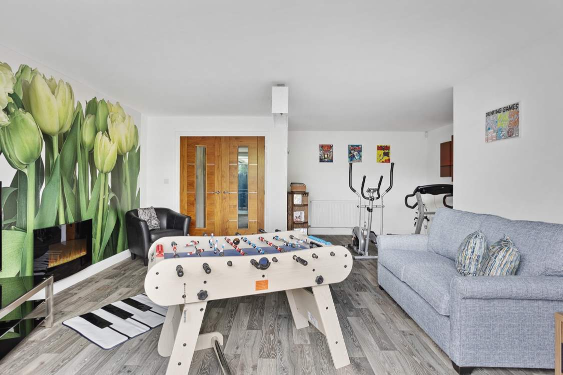 The games-room has double patio doors that open out to the hot tub decking.