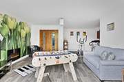 The games-room has double patio doors that open out to the hot tub decking.