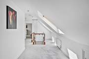 The upstairs landing is spacious and links all of the bedrooms together.