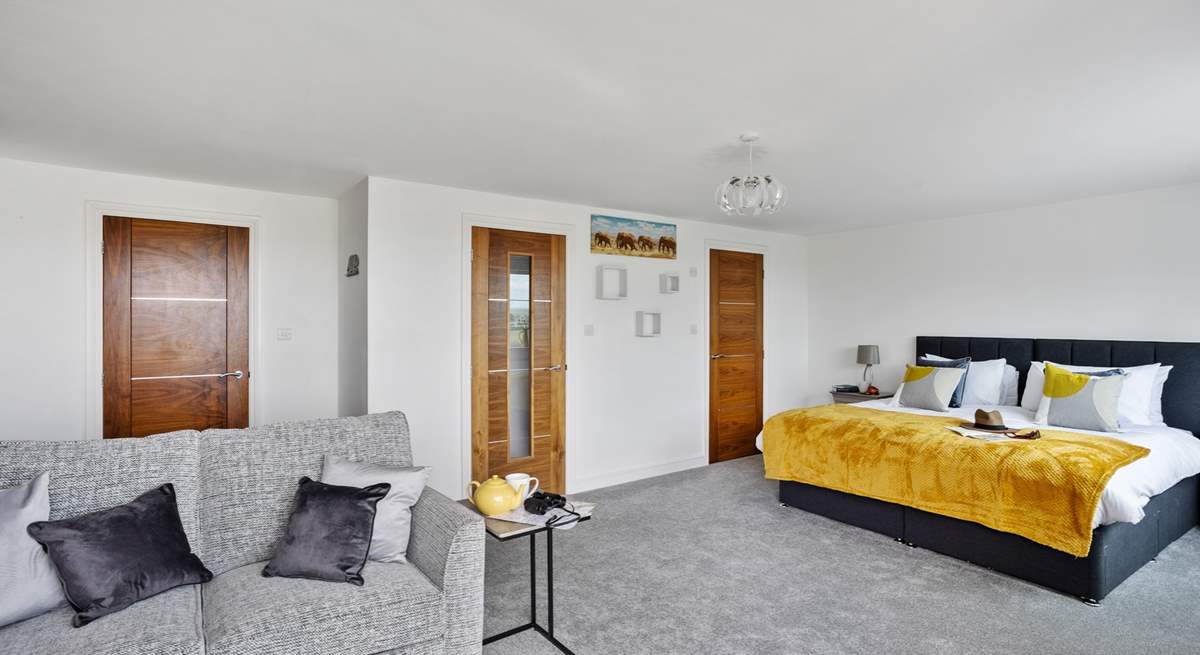 If required the sofa converts into a double bed. This room also has a walk-in wardrobe and an en suite shower-room. 