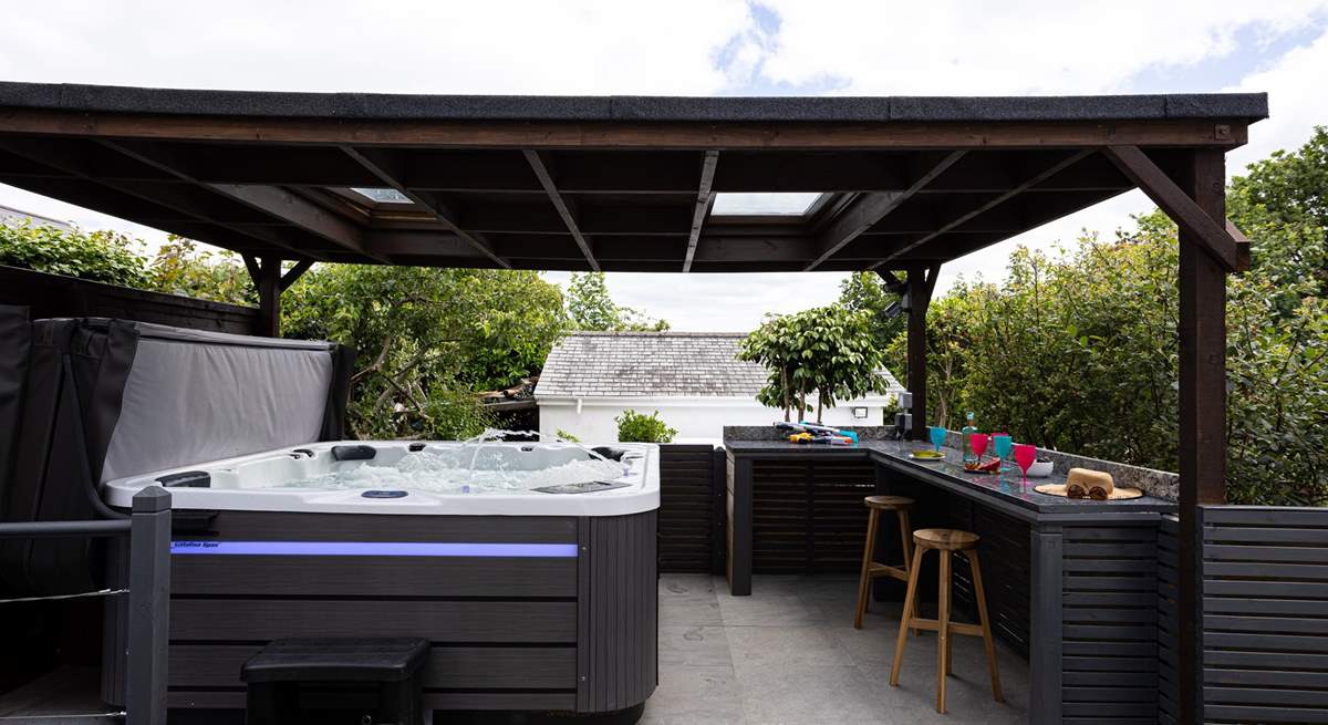 The sociable hot tub area sits to the front of the house, the perfect spot for all the family to enjoy.