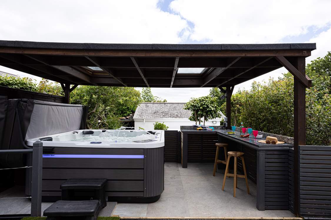 The sociable hot tub area sits to the front of the house, the perfect spot for all the family to enjoy.