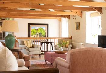 As you step up to the open plan living-room you will find a lovingly presented space.