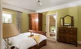 Steps lead down from the bedroom to the gorgeous en suite. - Thumbnail Image