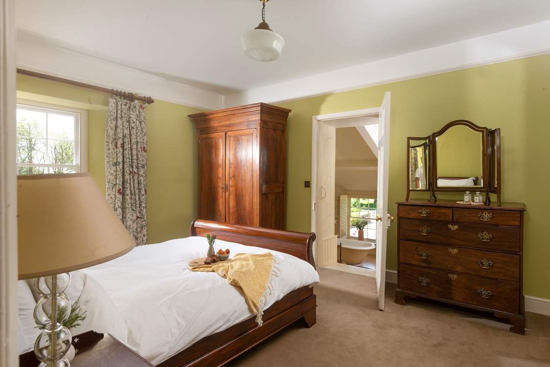 Steps lead down from the bedroom to the gorgeous en suite.