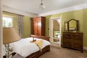 Steps lead down from the bedroom to the gorgeous en suite.