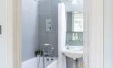 The sweet en suite has a shower for a quick morning rinse-off or a bath when you want to relax. - Thumbnail Image