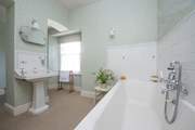 Period styling in the family bathroom.