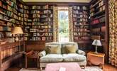 Curl up with a good book in the library - there are plenty to choose from! - Thumbnail Image