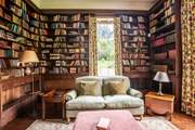 Curl up with a good book in the library - there are plenty to choose from!
