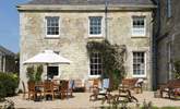 The sunny terrace beckons you outside for meals al fresco or simply lounging in the sunshine. - Thumbnail Image