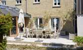 Enjoy a spot of al fresco dining on the spacious patio terrace. - Thumbnail Image