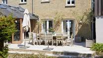 Enjoy a spot of al fresco dining on the spacious patio terrace.