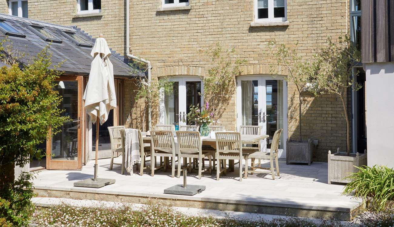 Enjoy a spot of al fresco dining on the spacious patio terrace.