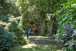 A children's play-area and cooling shady areas in the garden.