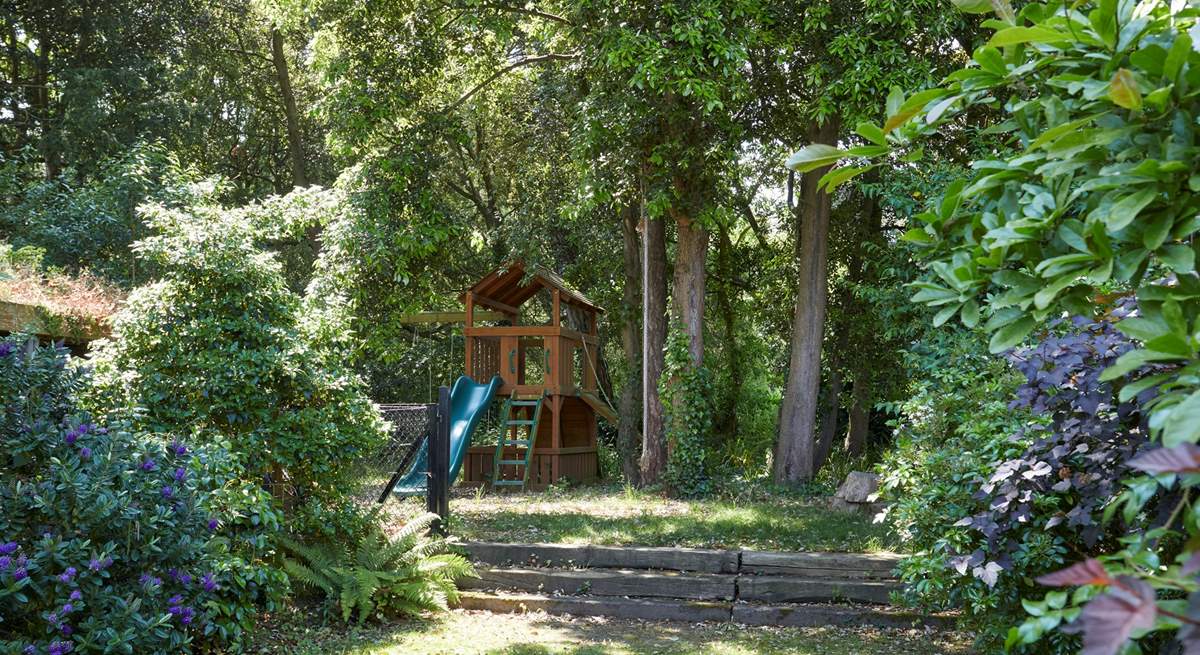 A children's play-area and cooling shady areas in the garden.