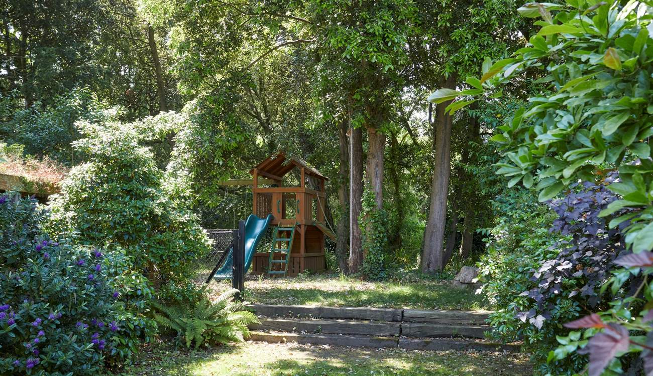 A children's play-area and cooling shady areas in the garden.