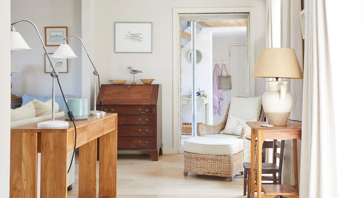 The sitting-room perfectly connects with the entrance hall.