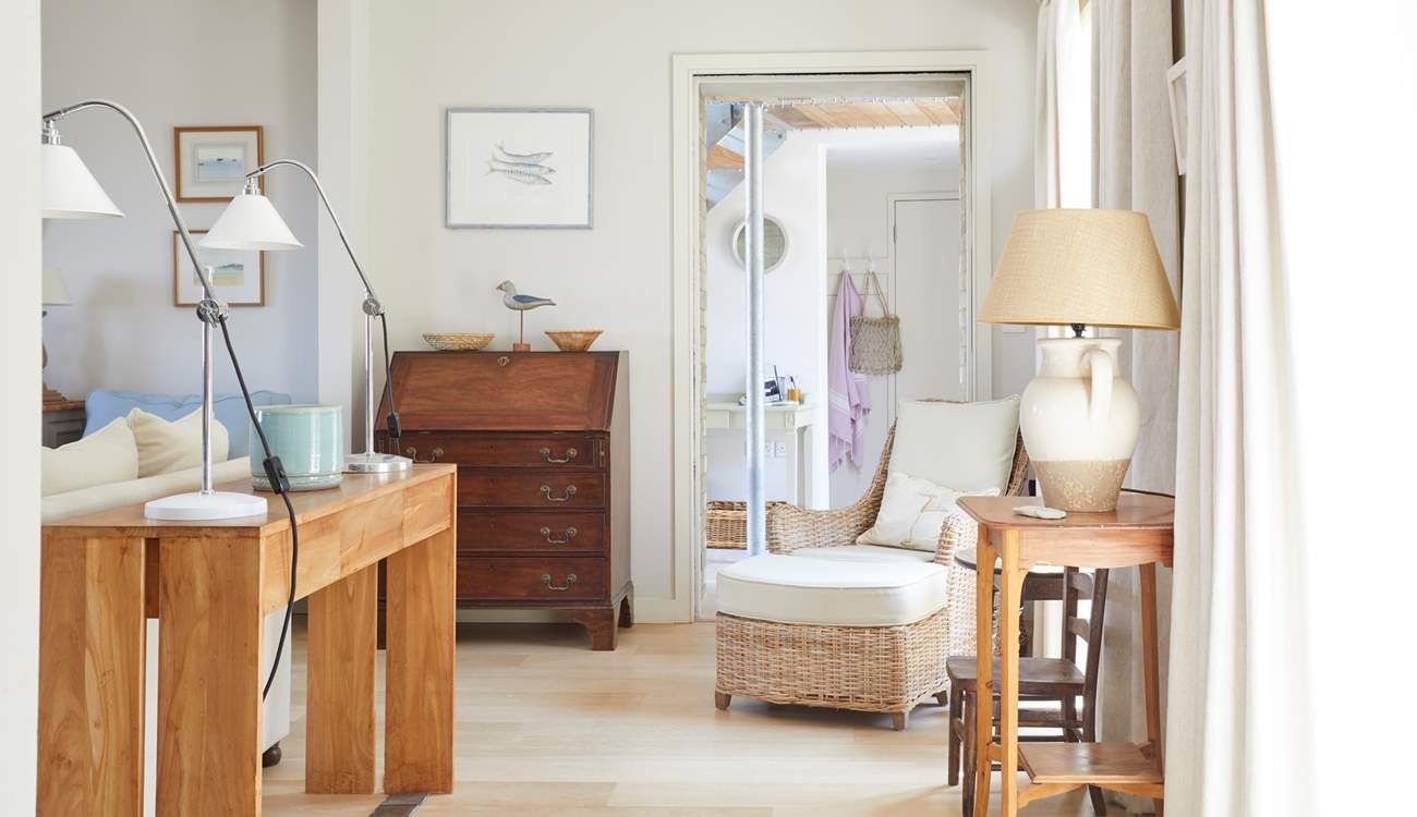 The sitting-room perfectly connects with the entrance hall.