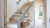 The welcoming entrance hall with its stylish staircase ascending to the first floor. 