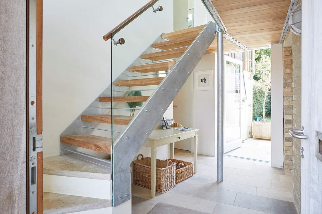 The welcoming entrance hall with its stylish staircase ascending to the first floor.