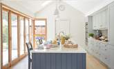 Bathed in natural light, the kitchen creates a relaxing, cooking and dining environment. - Thumbnail Image