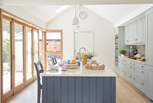 Bathed in natural light, the kitchen creates a relaxing, cooking and dining environment.