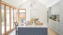 Bathed in natural light, the kitchen creates a relaxing, cooking and dining environment.