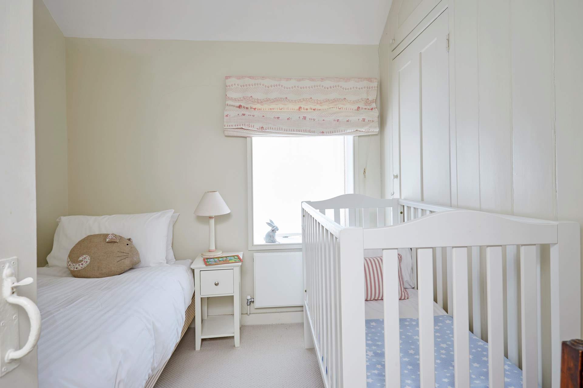 A single/cot room with lovely garden views.