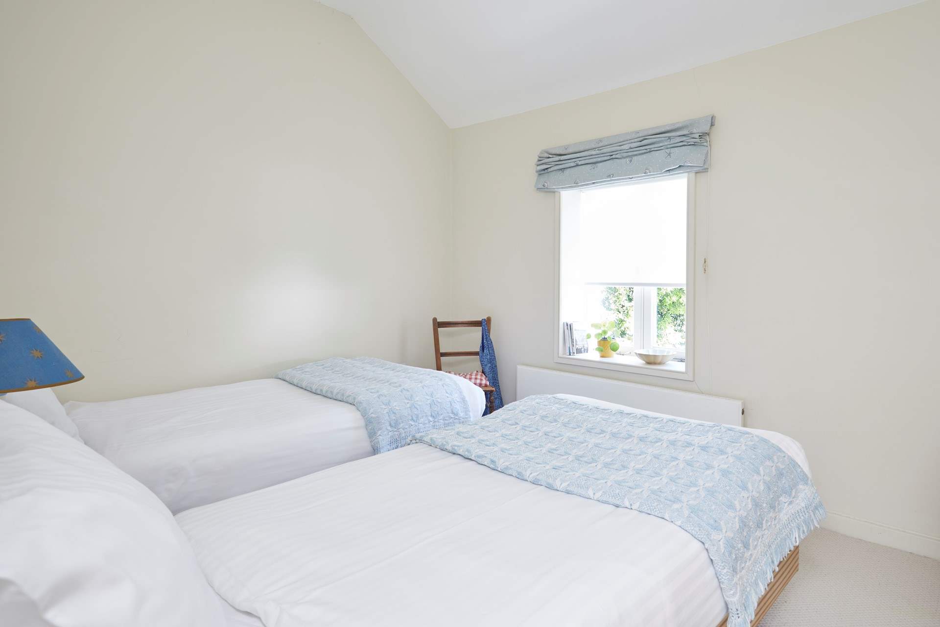 At the front of the home, the twin room enjoys sea views.