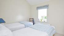 At the front of the home, the twin room enjoys sea views.