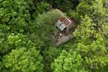 Nestled in the forest, this perfectly rustic retreat offers a soulful escape. 