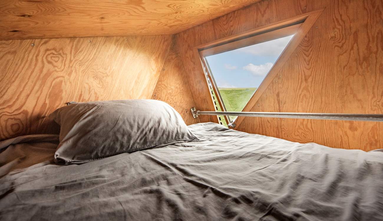 The snug double bed is the perfect spot for a restful night's sleep. 