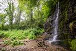 The picturesque waterfall can be found hidden at the bottom of the quarry. 